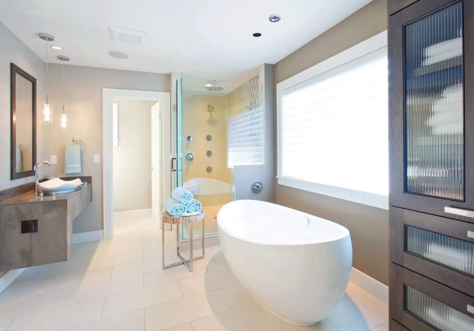 A bathroom with a large tub and shower.