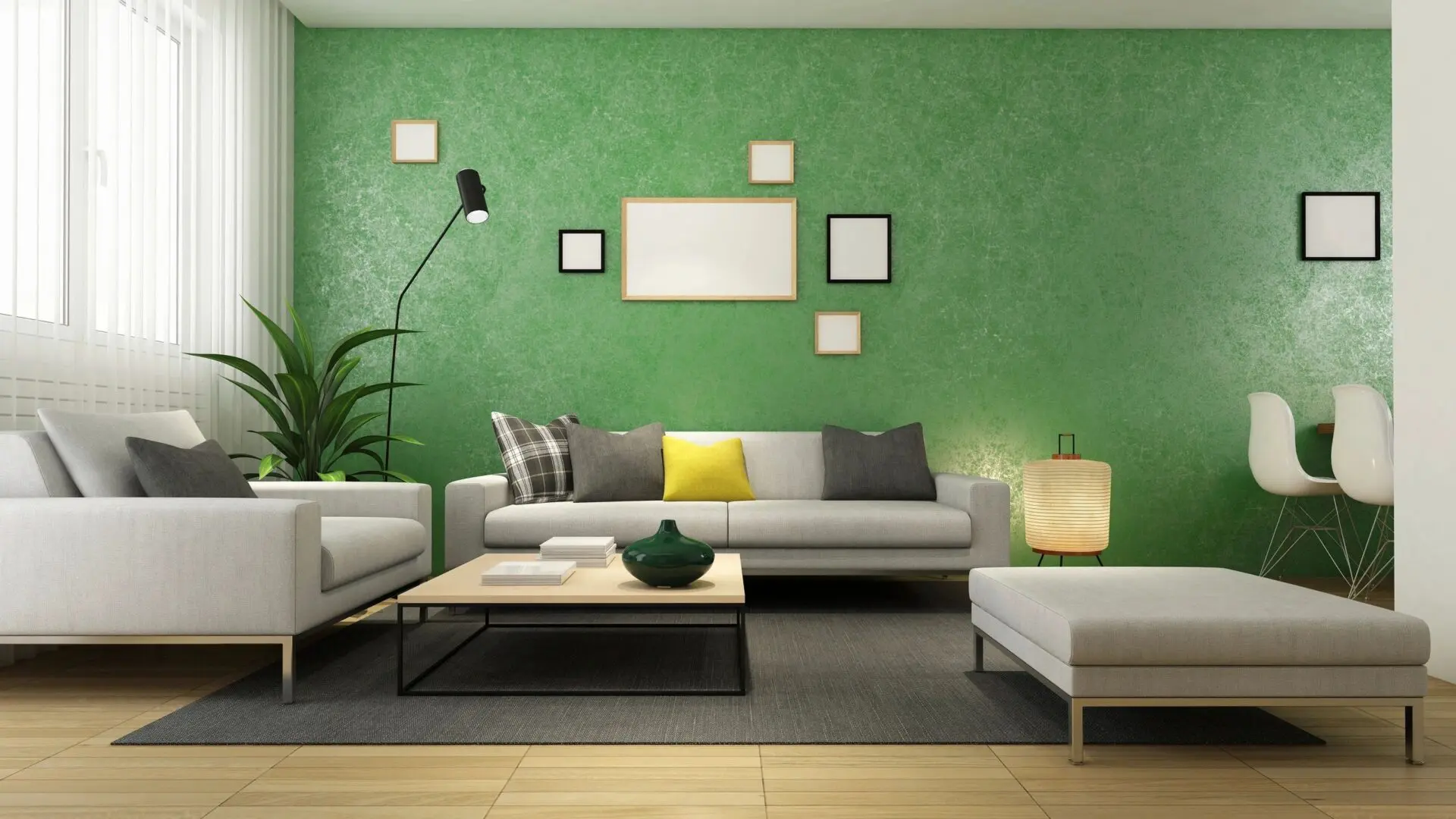 A living room with green walls and white furniture.